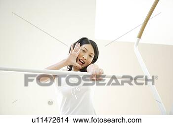 Stock Photo - young woman calling 
out from upstairs. 
fotosearch - search 
stock photos, 
pictures, images, 
and photo clipart