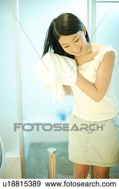 Stock Photograph - young woman drying 
hair with towel. 
fotosearch - search 
stock photos, 
pictures, images, 
and photo clipart
