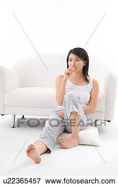 Picture - young woman eating 
cookie. fotosearch 
- search stock 
photos, pictures, 
images, and photo 
clipart