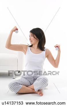 Stock Photo - young woman exercising. 
fotosearch - search 
stock photos, 
pictures, images, 
and photo clipart