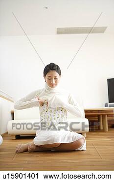 Stock Photography - young woman getting 
dressed. fotosearch 
- search stock 
photos, pictures, 
images, and photo 
clipart