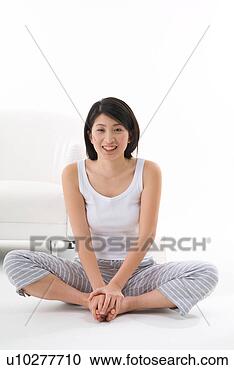 Stock Photography - young woman sitting 
on floor. fotosearch 
- search stock 
photos, pictures, 
images, and photo 
clipart