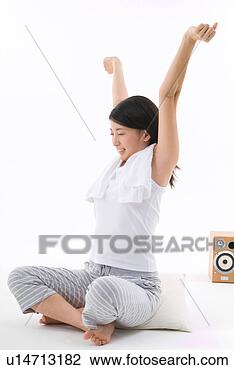 Stock Photo - young woman sitting 
with arms outstretched. 
fotosearch - search 
stock photos, 
pictures, images, 
and photo clipart