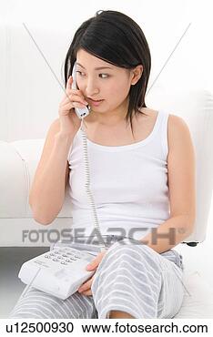 Stock Photography - young woman talking 
on phone. fotosearch 
- search stock 
photos, pictures, 
images, and photo 
clipart