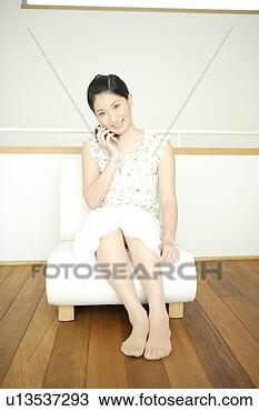 Stock Photo - young woman talking 
on mobile phone. 
fotosearch - search 
stock photos, 
pictures, images, 
and photo clipart
