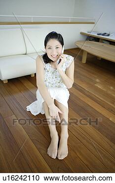 Stock Photography - young woman talking 
on mobile phone. 
fotosearch - search 
stock photos, 
pictures, images, 
and photo clipart