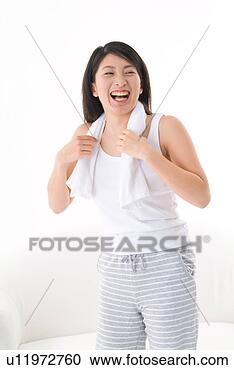 Stock Photography - young woman with 
towel around neck. 
fotosearch - search 
stock photos, 
pictures, images, 
and photo clipart