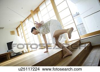 Stock Photo - young woman tripping 
over step. fotosearch 
- search stock 
photos, pictures, 
images, and photo 
clipart