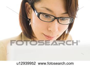 Stock Photo - a mid adult woman 
working with computer. 
fotosearch - search 
stock photos, 
pictures, images, 
and photo clipart