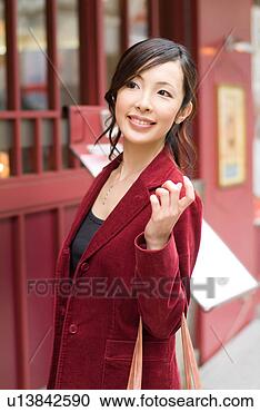 Stock Photography - a mid adult woman 
standing. fotosearch 
- search stock 
photos, pictures, 
images, and photo 
clipart