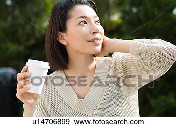 Stock Photograph - a mid adult woman 
looking up. fotosearch 
- search stock 
photos, pictures, 
images, and photo 
clipart