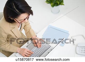 Picture - a mid adult woman 
working with computer. 
fotosearch - search 
stock photos, 
pictures, images, 
and photo clipart