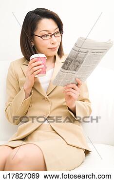 Stock Photograph - a mid adult woman 
reading newspaper. 
fotosearch - search 
stock photos, 
pictures, images, 
and photo clipart