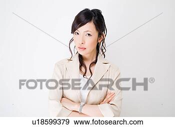 Stock Photograph - a mid adult woman 
looking at camera 
with her arms 
crossed. fotosearch 
- search stock 
photos, pictures, 
images, and photo 
clipart