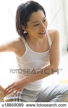 Stock Photograph - a mid adult woman 
stretching. fotosearch 
- search stock 
photos, pictures, 
images, and photo 
clipart