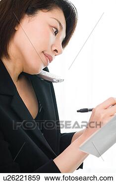 Stock Photograph - a mid adult woman 
talking with mobile 
phone. fotosearch 
- search stock 
photos, pictures, 
images, and photo 
clipart