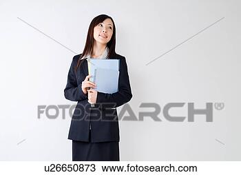 Stock Photo - a mid adult woman 
holding documents. 
fotosearch - search 
stock photos, 
pictures, images, 
and photo clipart