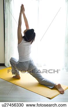 Stock Photography - a mid adult woman 
doing yoga. fotosearch 
- search stock 
photos, pictures, 
images, and photo 
clipart