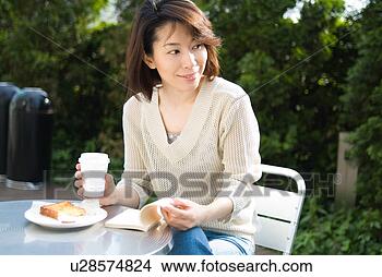 Stock Photo - a mid adult woman 
reading a book. 
fotosearch - search 
stock photos, 
pictures, images, 
and photo clipart