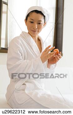 Stock Photo - a mid adult woman 
in bathrobe. fotosearch 
- search stock 
photos, pictures, 
images, and photo 
clipart