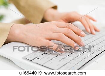 Stock Photograph - a woman typing, 
close-up. fotosearch 
- search stock 
photos, pictures, 
images, and photo 
clipart