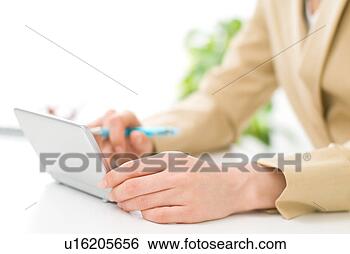 Stock Photo - a woman using 
electronic dictionary, 
close-up. fotosearch 
- search stock 
photos, pictures, 
images, and photo 
clipart