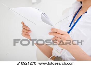 Stock Photography - midsection of 
a young woman 
reading document. 
fotosearch - search 
stock photos, 
pictures, images, 
and photo clipart