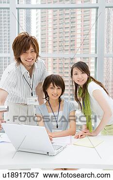 Picture - three young business 
people smiling. 
fotosearch - search 
stock photos, 
pictures, images, 
and photo clipart