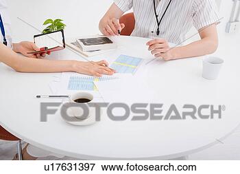 Picture - two people discussing. 
fotosearch - search 
stock photos, 
pictures, images, 
and photo clipart
