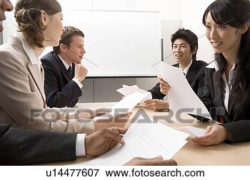 Picture - business people 
having meeting. 
fotosearch - search 
stock photos, 
pictures, images, 
and photo clipart