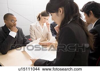 Stock Photo - business people 
having meeting. 
fotosearch - search 
stock photos, 
pictures, images, 
and photo clipart