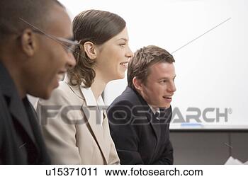 Stock Photography - business people 
having meeting. 
fotosearch - search 
stock photos, 
pictures, images, 
and photo clipart