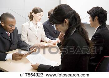 Stock Photo - business people 
having meeting. 
fotosearch - search 
stock photos, 
pictures, images, 
and photo clipart