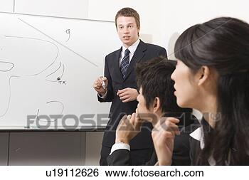 Stock Photo - business people 
having meeting. 
fotosearch - search 
stock photos, 
pictures, images, 
and photo clipart