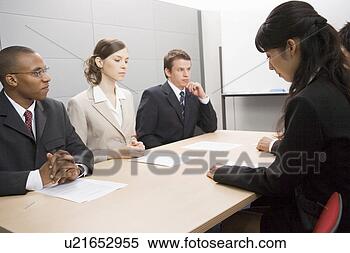 Stock Image - business people 
having meeting. 
fotosearch - search 
stock photos, 
pictures, images, 
and photo clipart