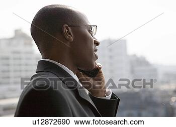 Stock Photography - businessman using 
mobile phone. 
fotosearch - search 
stock photos, 
pictures, images, 
and photo clipart