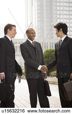 Stock Photo - businessmen shaking 
hands. fotosearch 
- search stock 
photos, pictures, 
images, and photo 
clipart