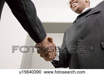 Stock Photography - businessmen shaking 
hands. fotosearch 
- search stock 
photos, pictures, 
images, and photo 
clipart
