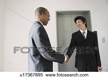 Stock Image - businessmen shaking 
hands. fotosearch 
- search stock 
photos, pictures, 
images, and photo 
clipart