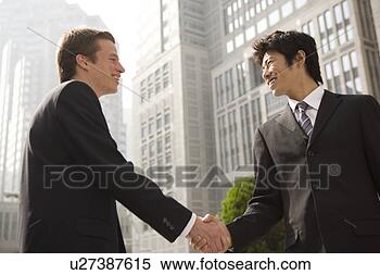 Stock Image - businessmen shaking 
hands. fotosearch 
- search stock 
photos, pictures, 
images, and photo 
clipart