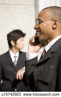 Stock Photo - businessmen using 
mobile phone. 
fotosearch - search 
stock photos, 
pictures, images, 
and photo clipart