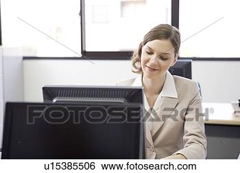 Stock Photo - businesswoman 
working on computer. 
fotosearch - search 
stock photos, 
pictures, images, 
and photo clipart