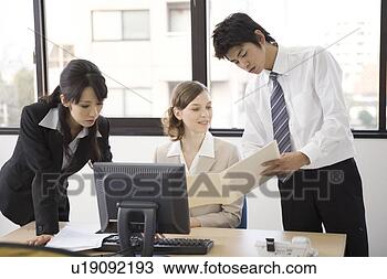 Stock Photo - three business 
people working 
in office. fotosearch 
- search stock 
photos, pictures, 
images, and photo 
clipart