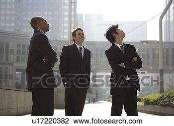 Stock Photo - three businessmen 
looking up. fotosearch 
- search stock 
photos, pictures, 
images, and photo 
clipart