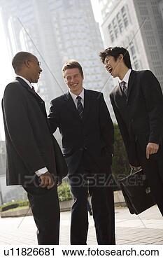 Stock Photography - three businessmen 
talking. fotosearch 
- search stock 
photos, pictures, 
images, and photo 
clipart