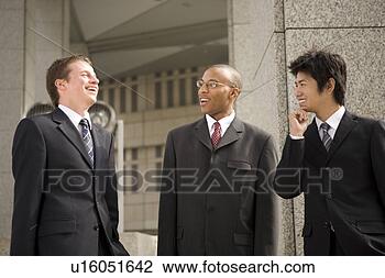 Stock Photo - three businessmen 
talking. fotosearch 
- search stock 
photos, pictures, 
images, and photo 
clipart