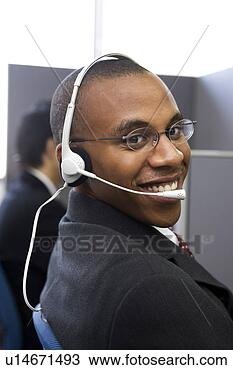 Stock Photo - young man working 
in call center. 
fotosearch - search 
stock photos, 
pictures, images, 
and photo clipart