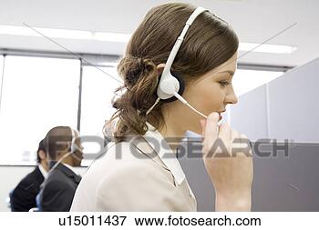 Picture - young woman working 
in call center. 
fotosearch - search 
stock photos, 
pictures, images, 
and photo clipart