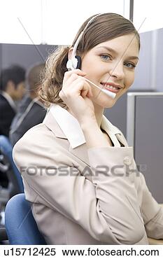 Stock Image - young woman working 
in call center. 
fotosearch - search 
stock photos, 
pictures, images, 
and photo clipart