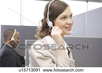 Stock Photography - young woman working 
in call center. 
fotosearch - search 
stock photos, 
pictures, images, 
and photo clipart